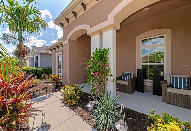 view of exterior entry featuring a patio