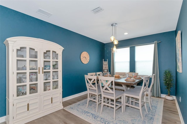 dining room featuring light hardwood / wood-style floors