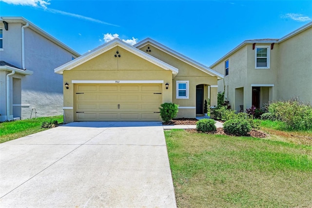 view of front facade with a front lawn and a garage