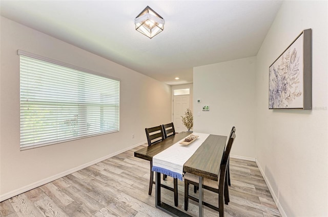 dining area featuring light wood-type flooring