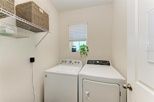 washroom featuring separate washer and dryer