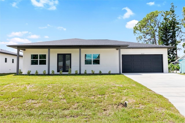 view of front of home featuring driveway, an attached garage, french doors, a front yard, and stucco siding