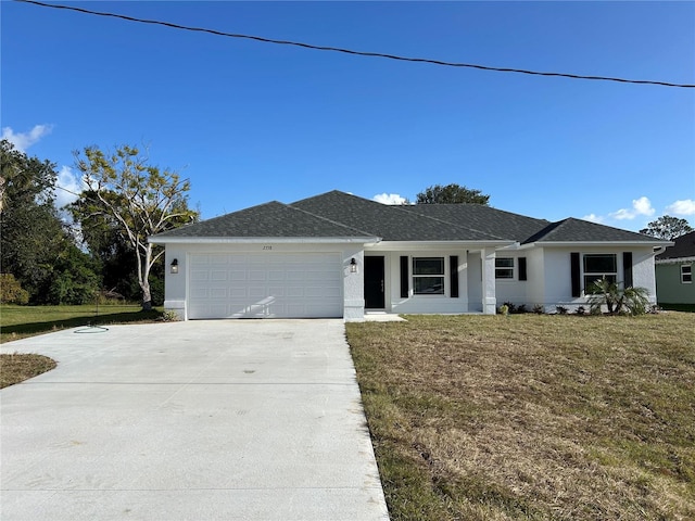 ranch-style house featuring a garage and a front lawn