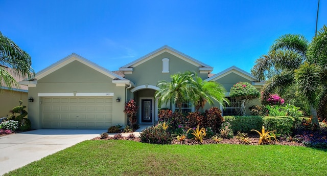 view of front facade with a front lawn and a garage