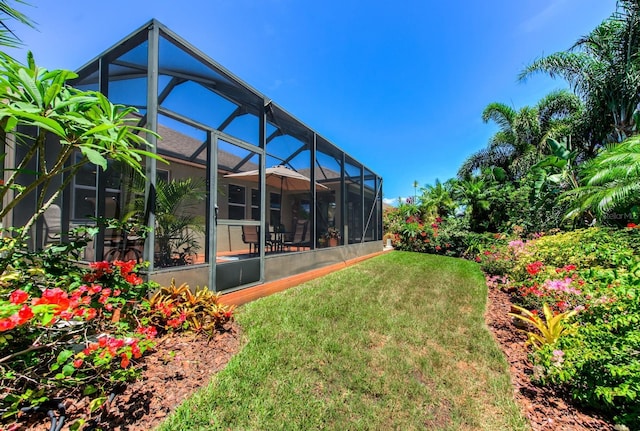 view of yard with a lanai