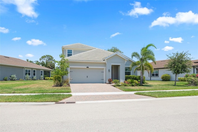 view of front facade featuring a front yard and a garage