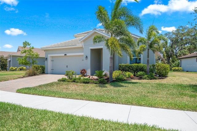 view of front facade with a garage and a front lawn