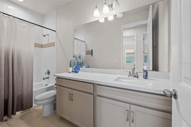 full bathroom featuring tile patterned flooring, vanity, toilet, and shower / tub combo