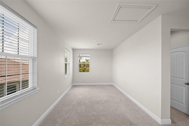 empty room featuring light carpet