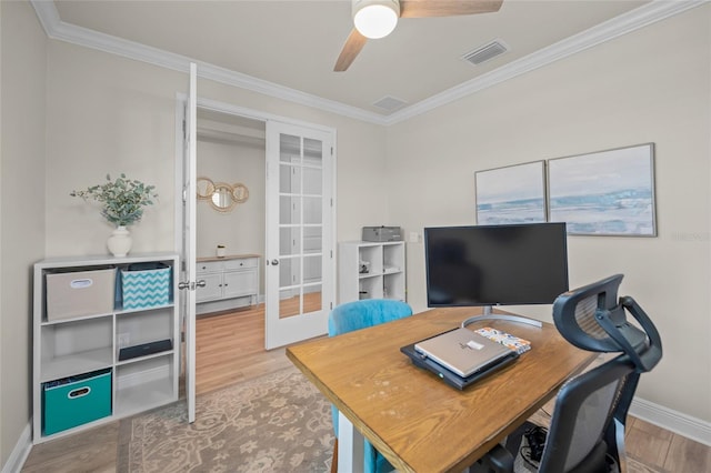 office featuring french doors, light hardwood / wood-style floors, ceiling fan, and ornamental molding