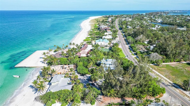 bird's eye view featuring a water view and a view of the beach