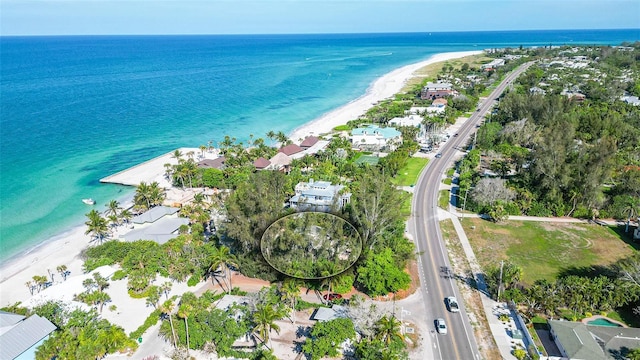 aerial view featuring a water view and a view of the beach