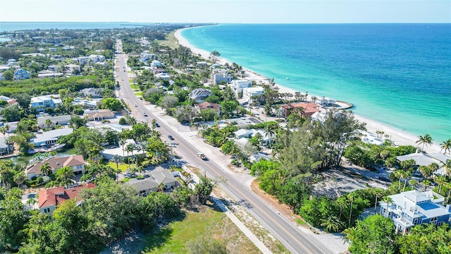 birds eye view of property with a view of the beach and a water view