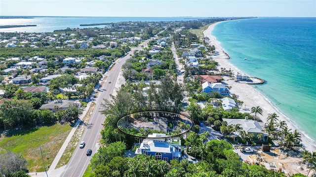 aerial view featuring a water view and a view of the beach