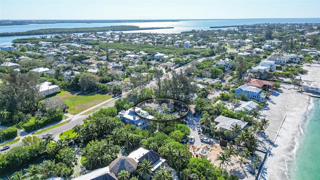 bird's eye view featuring a beach view and a water view