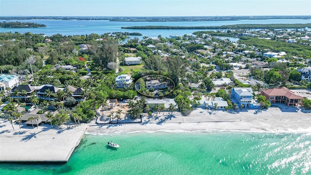 aerial view featuring a water view and a view of the beach