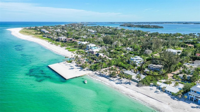 drone / aerial view featuring a view of the beach and a water view