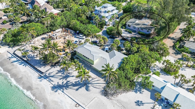 aerial view featuring a water view and a beach view