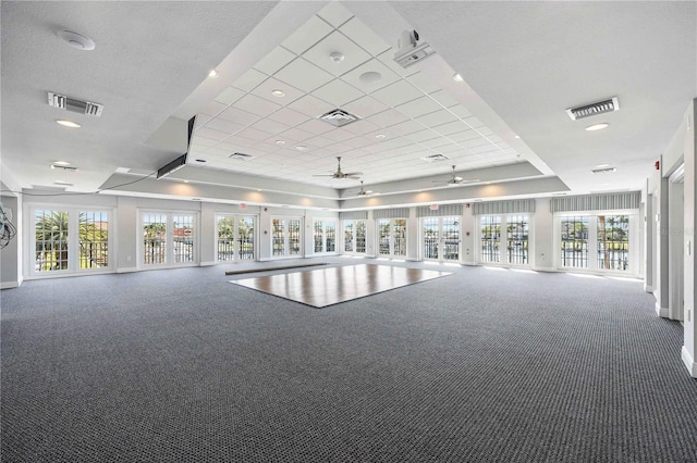 interior space with ceiling fan and carpet floors