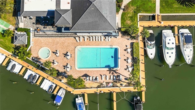 birds eye view of property featuring a water view