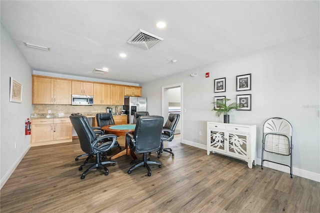 office with dark hardwood / wood-style flooring