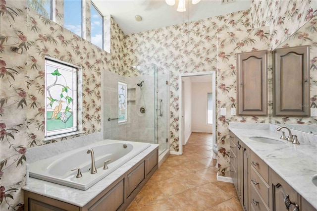 bathroom with tile patterned floors, plus walk in shower, and vanity