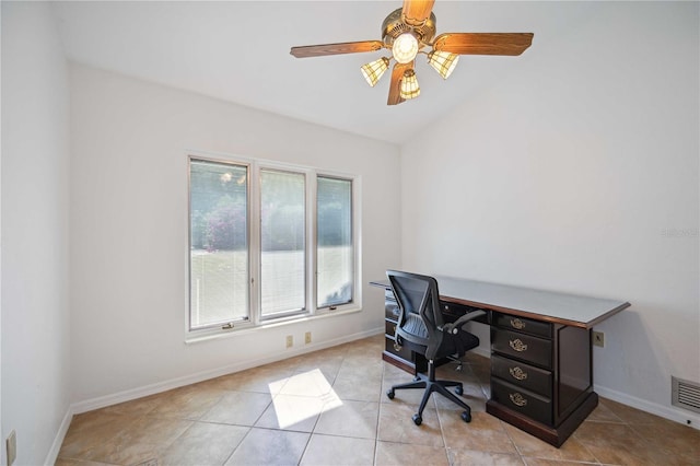 office area featuring ceiling fan, light tile patterned flooring, and lofted ceiling