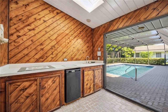 interior space featuring a skylight and sink