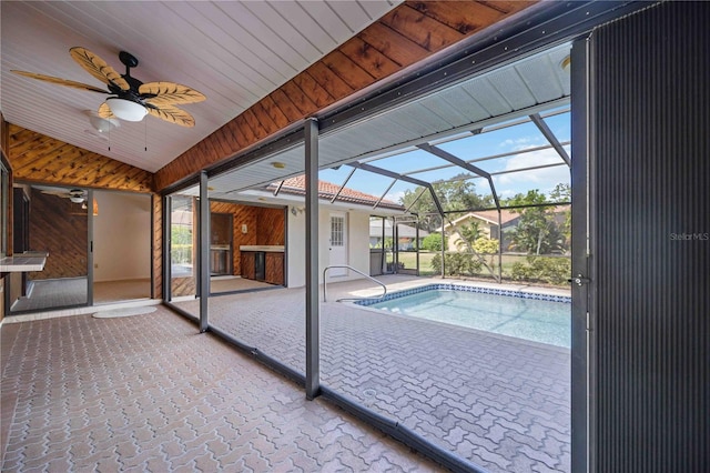 view of swimming pool with ceiling fan