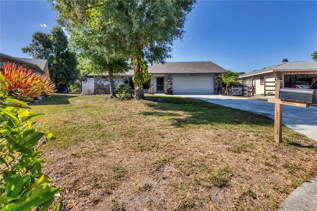 ranch-style house featuring a front yard and a garage