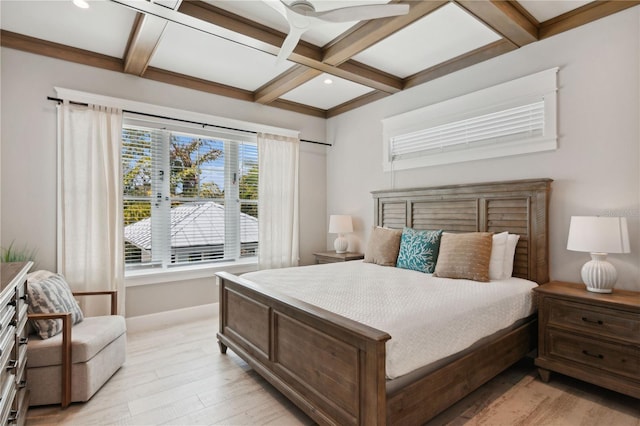 bedroom with beamed ceiling, ceiling fan, light hardwood / wood-style floors, and coffered ceiling