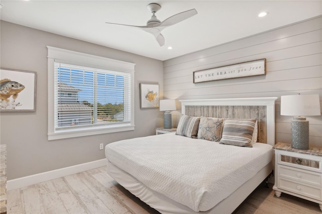 bedroom with ceiling fan and light hardwood / wood-style flooring