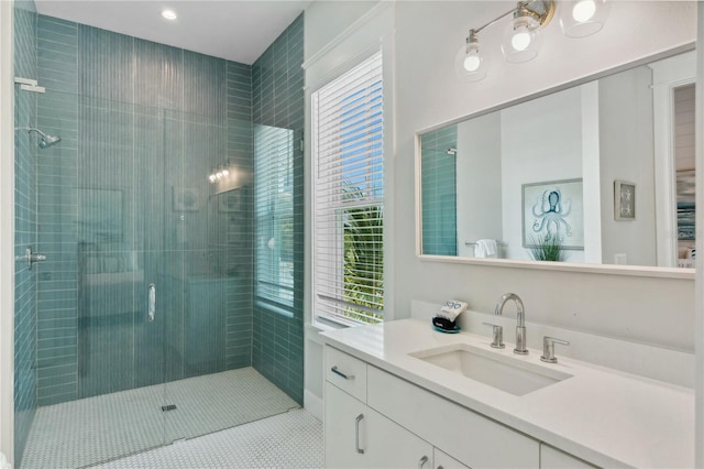 bathroom with tile patterned flooring, vanity, and a shower with shower door