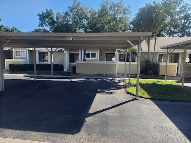 view of parking featuring a carport