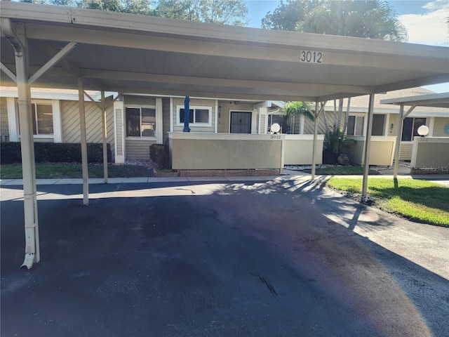 exterior space featuring a carport