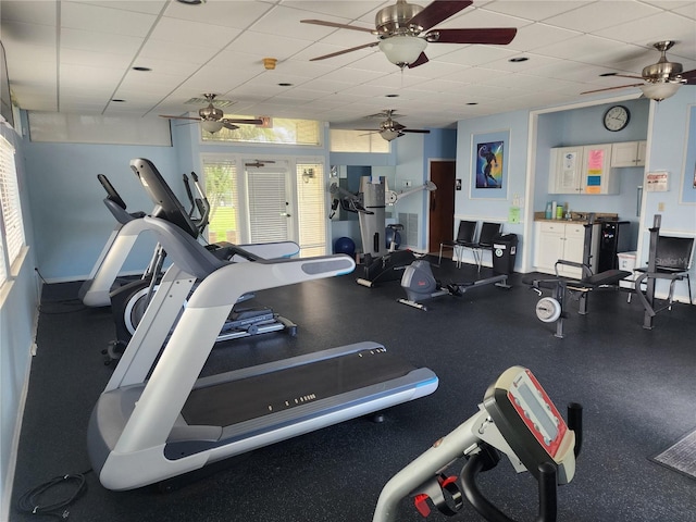 workout area with a paneled ceiling