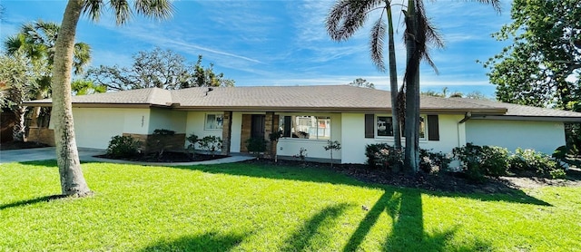 3637 Mineola Dr, Sarasota, FL 34239 - ranch-style home featuring stucco siding, an attached garage, a front lawn, and concrete driveway