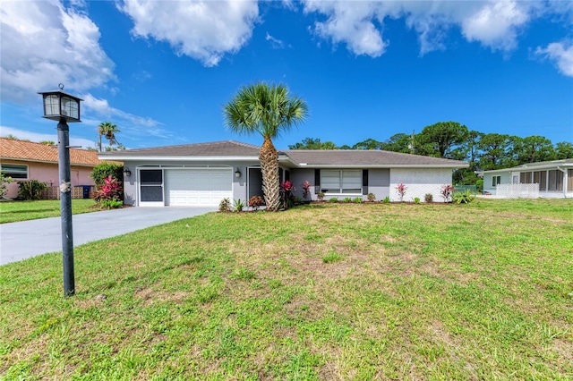 single story home featuring a garage and a front lawn