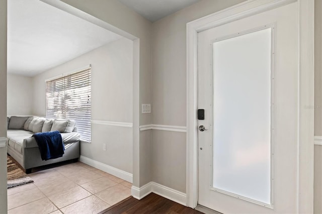 entrance foyer featuring light tile floors