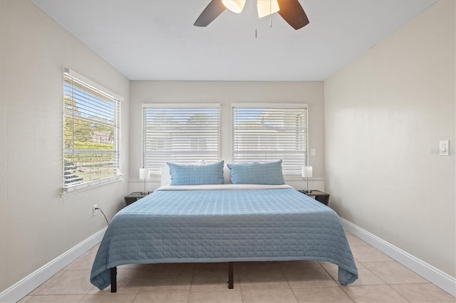 tiled bedroom with ceiling fan