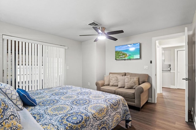 bedroom featuring ceiling fan and dark wood-type flooring