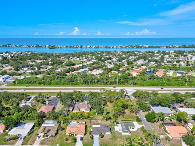 drone / aerial view featuring a water view