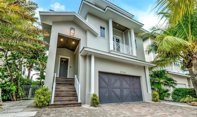 view of front of house with a balcony and a garage