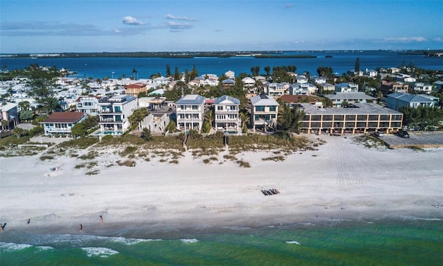 drone / aerial view with a beach view and a water view