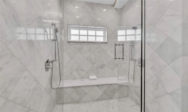 bathroom featuring tiled shower