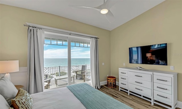 bedroom with access to exterior, ceiling fan, and light hardwood / wood-style floors