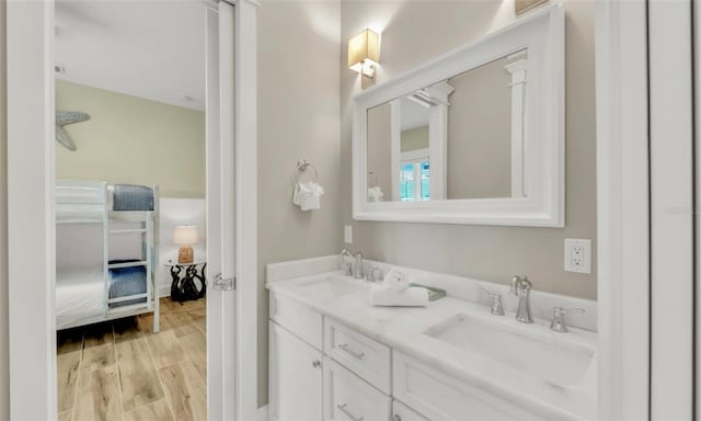 bathroom with vanity and wood-type flooring