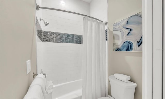 bathroom featuring shower / bathtub combination with curtain and toilet