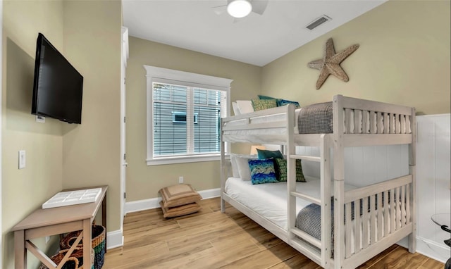 bedroom with ceiling fan and light hardwood / wood-style flooring