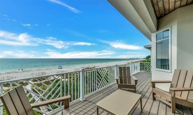 balcony with a view of the beach and a water view